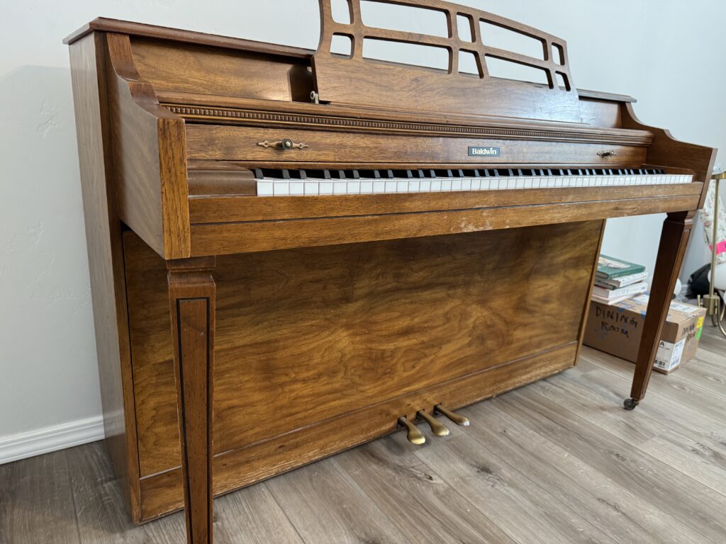 Full upright Baldwin piano in original finish before painting project.